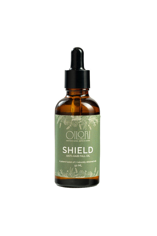 Oilori Shield Anti-Hair Fall Oil bottle made with botanical ingredients like tea tree, rosemary, and cedarwood oils