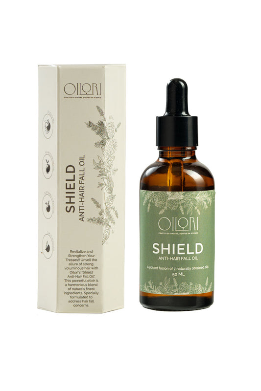 Elegant flat-lay of Oilori Shield Anti-Hair Fall Oil bottle representing pure botanical hair care