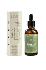 Elegant flat-lay of Oilori Shield Anti-Hair Fall Oil bottle representing pure botanical hair care