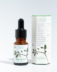 Oilori 10ml bottle of pure pine needle essential oil with its packaging on a white background.